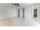 Bedroom featuring tile flooring, a closet, and an ensuite bathroom at 13254 Boulder Woods Cir, Orlando, FL 32824