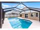 Screened in pool featuring a concrete deck and views of the home at 13254 Boulder Woods Cir, Orlando, FL 32824