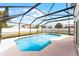 Screened in pool featuring a concrete deck and views of the fenced in backyard at 13254 Boulder Woods Cir, Orlando, FL 32824