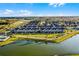 Aerial view of the community with lush landscaping and a picturesque pond creates a tranquil setting at 13727 Bressler Aly, Windermere, FL 34786