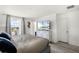 Calm bedroom features hardwood floors, a large window, and neutral decor at 13727 Bressler Aly, Windermere, FL 34786