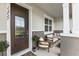 Inviting front porch with comfortable seating, perfect for relaxing outdoors at 13727 Bressler Aly, Windermere, FL 34786