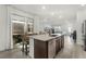 Modern kitchen with granite countertops, stainless steel appliances, and a breakfast bar at 13727 Bressler Aly, Windermere, FL 34786