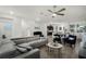 Open-concept living space with hardwood floors, modern furniture, and a cozy atmosphere at 13727 Bressler Aly, Windermere, FL 34786