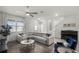Inviting living room offers hardwood floors, a ceiling fan, and access to the staircase at 13727 Bressler Aly, Windermere, FL 34786