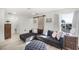 Living room features a sliding barn door, modern sectional sofa and lots of natural light at 13727 Bressler Aly, Windermere, FL 34786