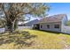 Spacious backyard with a privacy fence and mature landscaping at 14225 Southern Red Maple Dr, Orlando, FL 32828