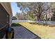 Large backyard with a privacy fence, patio and mature tree at 14225 Southern Red Maple Dr, Orlando, FL 32828