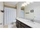 Bathroom features a large mirror, marbled vanity, shower, and toilet at 14225 Southern Red Maple Dr, Orlando, FL 32828