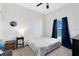 Neutral bedroom features a ceiling fan, plush carpet and a window at 14225 Southern Red Maple Dr, Orlando, FL 32828