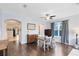 Spacious dining room featuring wood floors, natural light, and a ceiling fan at 14225 Southern Red Maple Dr, Orlando, FL 32828