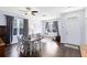 Bright living room featuring wood floors, plenty of natural light and access to the front door at 14225 Southern Red Maple Dr, Orlando, FL 32828
