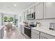 This kitchen is bright and features stainless steel appliances and tile floors at 1511 Fountain View St, Ormond Beach, FL 32174