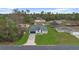 An elevated view of a cozy single-Gathering home with a lush green lawn in a tranquil neighborhood at 16659 Sw 21St Avenue Rd, Ocala, FL 34473