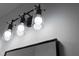 Modern black bathroom light fixture with clear glass shades at 16659 Sw 21St Avenue Rd, Ocala, FL 34473