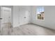 Bedroom with light gray flooring, a large window, and a closet at 16659 Sw 21St Avenue Rd, Ocala, FL 34473