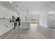 Beautiful modern kitchen featuring white cabinetry, quartz countertops, stainless steel appliances, and a stylish kitchen island at 16659 Sw 21St Avenue Rd, Ocala, FL 34473