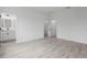 Spacious main bedroom featuring gray floors, an ensuite bath and walk-in closet at 16659 Sw 21St Avenue Rd, Ocala, FL 34473