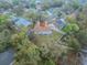 An elevated view presents a backyard and screened-in porch, enclosed by a white fence at 1730 Country Terrace Ln, Apopka, FL 32703