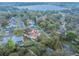 A wide aerial shot shows a home with a large backyard near a tranquil lake at 1730 Country Terrace Ln, Apopka, FL 32703