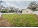 Large backyard with a well-maintained lawn and a white fence, great for outdoor activities and relaxation at 1730 Country Terrace Ln, Apopka, FL 32703
