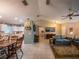 Open-concept living room with tile floors, seamless connection to dining and kitchen areas at 1730 Country Terrace Ln, Apopka, FL 32703