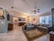 Comfortable living room featuring tile floors, cozy furniture, and a ceiling fan at 1730 Country Terrace Ln, Apopka, FL 32703