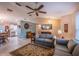Open-concept living room with tile floors, neutral walls, and ample space for entertaining at 1730 Country Terrace Ln, Apopka, FL 32703