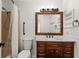 Cozy bathroom featuring a shower and tub, a marble countertop, and decorative mirror at 178 W Sabal Palm Pl # 62, Longwood, FL 32779