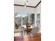 Bright dining area with large windows and seating for six at 178 W Sabal Palm Pl # 178, Longwood, FL 32779