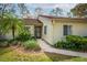 Home with a well-maintained lawn and tropical landscaping at 178 W Sabal Palm Pl # 178, Longwood, FL 32779