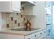 Bright kitchen features sleek cooktop, and white cabinets at 178 W Sabal Palm Pl # 178, Longwood, FL 32779
