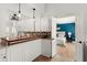 Cozy kitchen featuring wood countertops with a pass through to the main bedroom at 178 W Sabal Palm Pl # 178, Longwood, FL 32779