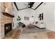Spacious living room featuring a stone fireplace, high ceilings and a ceiling fan at 178 W Sabal Palm Pl # 178, Longwood, FL 32779