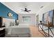 Bright main bedroom with modern decor, light walls and wood floor at 178 W Sabal Palm Pl # 178, Longwood, FL 32779