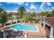 Community pool area with plenty of seating and lovely lake views at 178 W Sabal Palm Pl # 178, Longwood, FL 32779