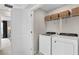 Convenient laundry room with modern appliances and practical storage solutions at 1959 Branched Oak Rd, St Cloud, FL 34771
