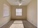 Simple bedroom with neutral walls, carpet, and a standard ceiling fan at 2341 Baronsmede Ct, Winter Garden, FL 34787