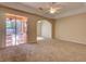 Spacious bedroom with sliding glass doors and arched entryway into ensuite bath at 2341 Baronsmede Ct, Winter Garden, FL 34787