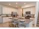 Modern kitchen with granite countertops, stainless steel appliances, and a large island with barstool seating at 2472 Firstlight Way, Winter Park, FL 32792