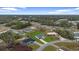 An aerial view of a single Gathering home surrounded by lush greenery and neighboring houses at 2480 Sw 147Th Lane Rd, Ocala, FL 34473