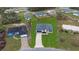 An aerial view of a single Gathering home on a well-manicured lawn surrounded by greenery at 2480 Sw 147Th Lane Rd, Ocala, FL 34473