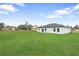 Large backyard with beautiful lawn, ideal for outdoor activities and gatherings at 2480 Sw 147Th Lane Rd, Ocala, FL 34473