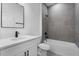 Modern bathroom featuring a shower over tub with gray tiles and a single sink vanity at 2480 Sw 147Th Lane Rd, Ocala, FL 34473