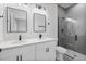 Sleek bathroom featuring a double vanity, modern fixtures, and a glass-enclosed shower at 2480 Sw 147Th Lane Rd, Ocala, FL 34473