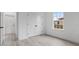 Spacious bedroom with a closet, a window, and light wood-look flooring at 2480 Sw 147Th Lane Rd, Ocala, FL 34473