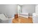 Bedroom with a bed, chair, wood floors, closet, and natural light at 2504 Helen Ave, Orlando, FL 32804