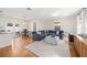 Spacious living area with hardwood floors, comfortable seating, and a dining table near the kitchen at 2504 Helen Ave, Orlando, FL 32804