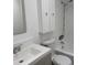 Clean bathroom featuring white cabinets and a shower/tub combo at 2727 W Oak Ridge Rd # 5-6, Orlando, FL 32809