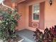 Charming covered front porch with gray floor and brown window shutters at 2727 W Oak Ridge Rd # 5-6, Orlando, FL 32809